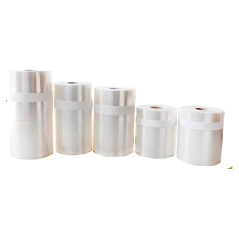 Cinco bobinas de film transparente para flowpack con una franja blanca impresa